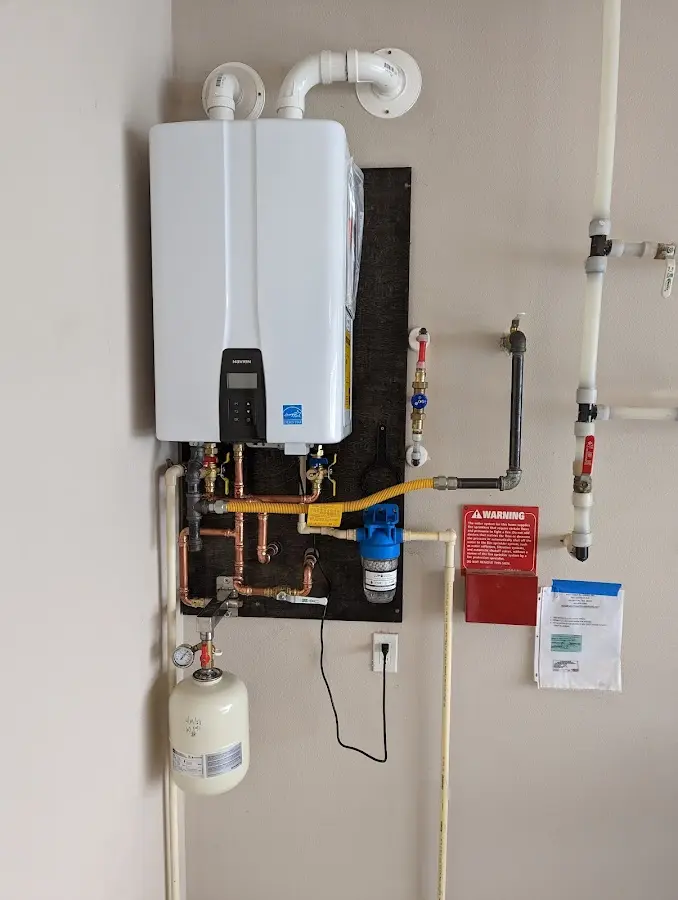 Professional plumber installing copper piping in a Prescott Valley home